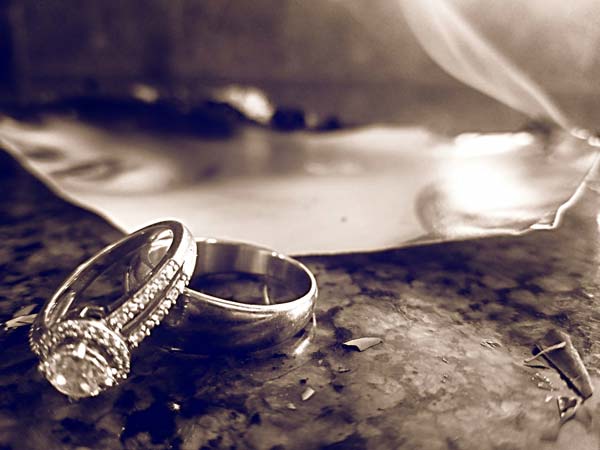 broken marriage wedding rings sitting on counter