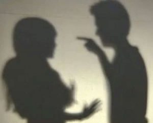 silhouette of couple arguing and engaging in emotional abuse
