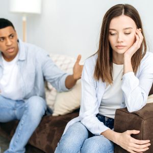 couple arguing with woman contemplating how she can end emotional abuse in her relationship